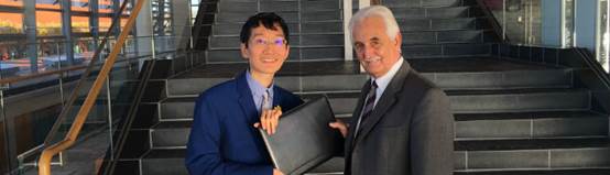 The petitioner handing over the petition to the Committee 