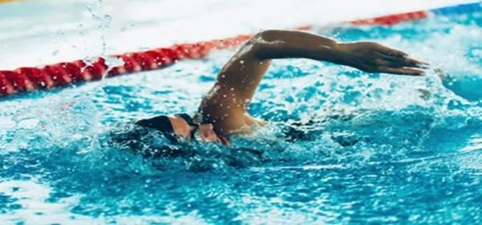 A person swimming in a pool
Description automatically generated with medium confidence