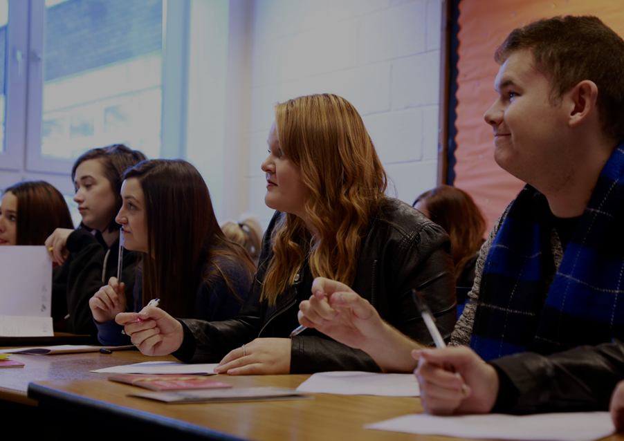 A group of people sitting at a table

Description automatically generated