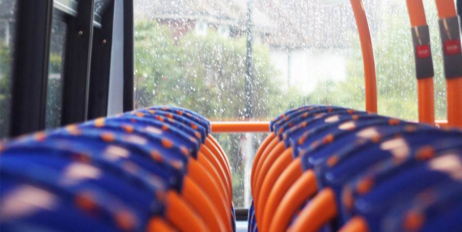 A group of orange and blue chairs

Description automatically generated