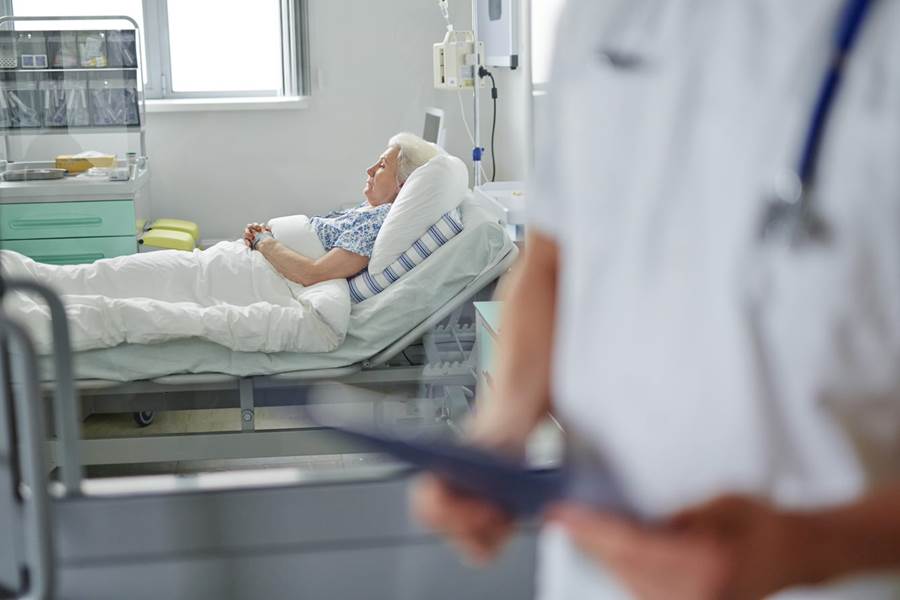 A person lying in a hospital bed

AI-generated content may be incorrect.